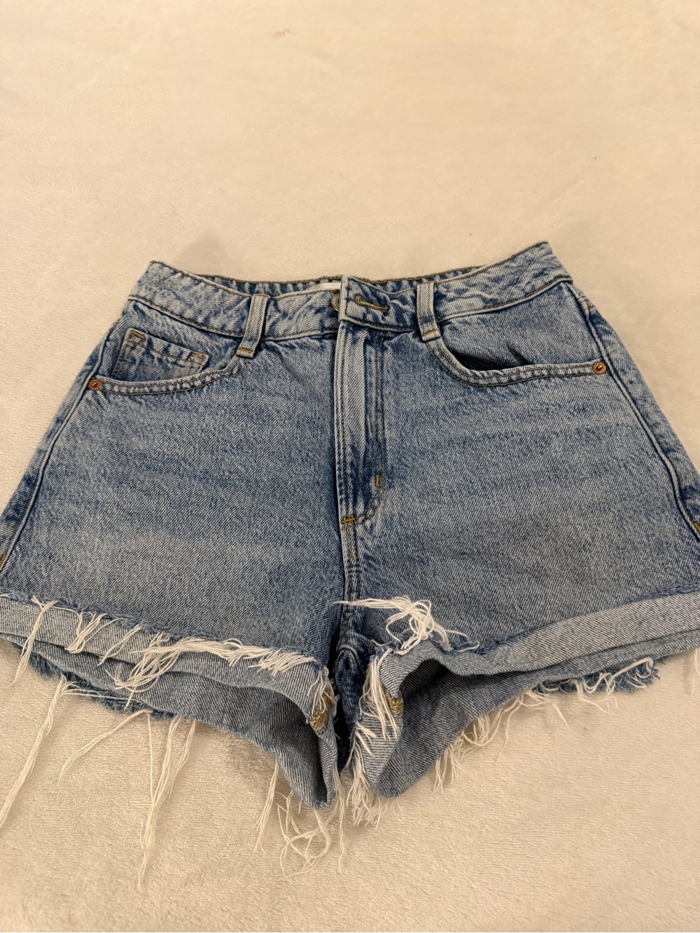 Dynamite Womenโs Light Blue Distressed Denim Shorts